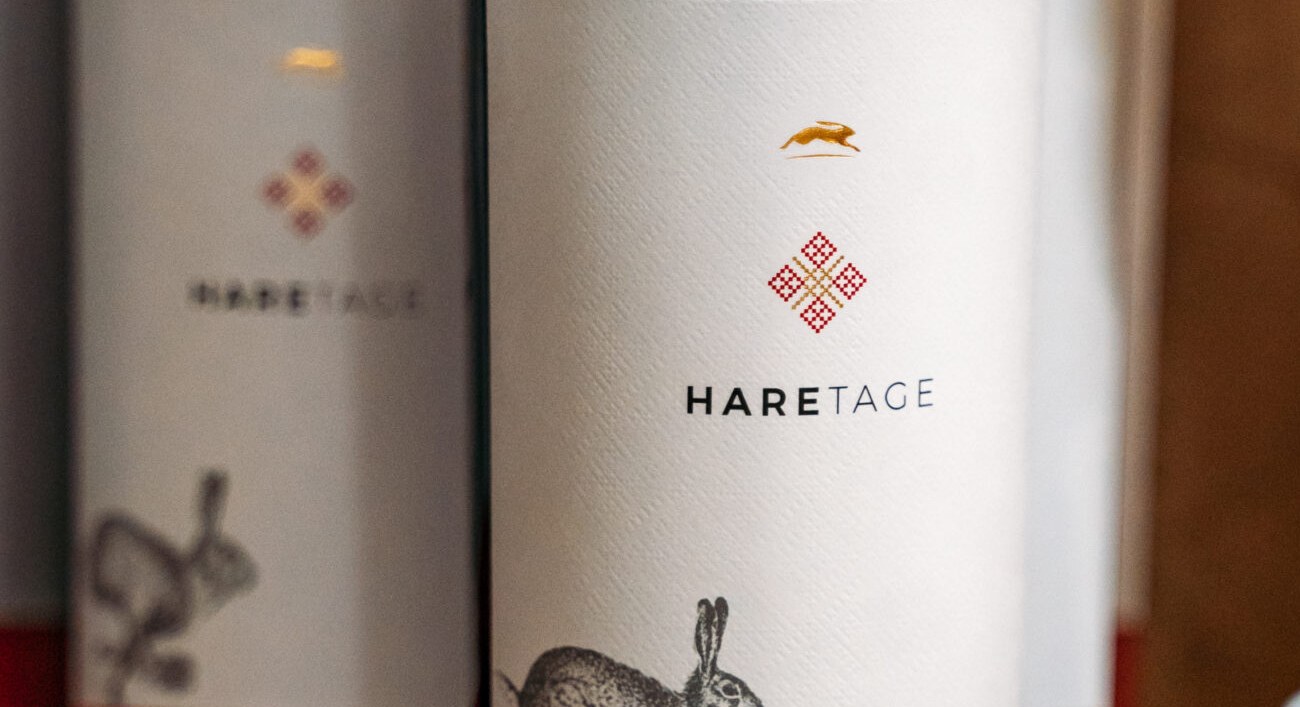 Two bottles of Haretage, the gold hare above the label